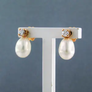 18k rosé gouden oorknoppen met parel en briljant geslepen diamant kopen? Bied vanaf 280!