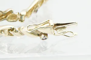 Chique gouden (14krt) & diamanten (0.10ct) "Slinger / Guirlande" armband kopen? Bied vanaf 230!