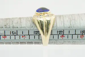 62 - 14 karaat geel gouden ring met blauwe cabuchon geslepen hartvormige steen kopen? Bied vanaf 200!