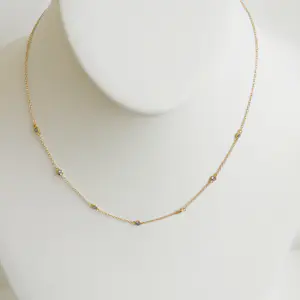 Geelgouden ketting met tanzaniet kopen? Bied vanaf 475!