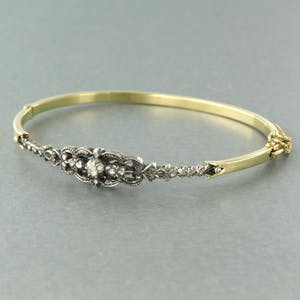 14k gouden scharnierarmband met een zilveren kop bezet met roos diamanten kopen? Bied vanaf 500!