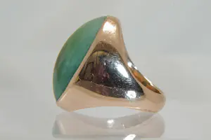 77 - Beneden wettelijk roségoud gehalte ring met ovale groene steen kopen? Bied vanaf 280!