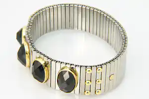 Opvallende staal en 18 krt gouden NOMINATION armband - met 4 grote stenen verkocht voor € 120!
