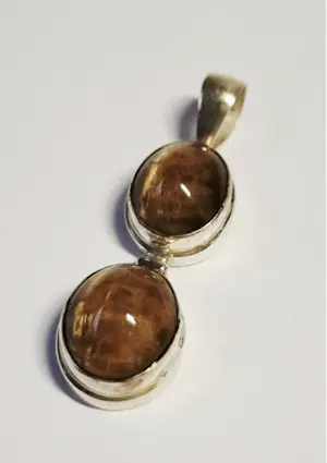 Nieuwe handgemaakte  langwerpige zilveren hanger met een mooie tijgerogen kopen? Bied vanaf 60!