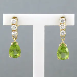 18k gouden oorhangers met peridot en briljant geslepen diamant tot 0.26ct kaufen? Bieten Sie von 375!
