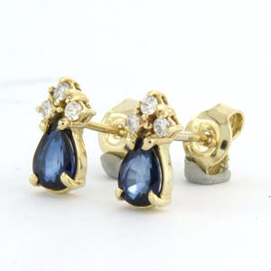 14k geelgouden oorknoppen bezet met saffier 1,20ct en briljant geslepen diamant kopen? Bied vanaf 260!