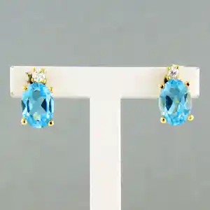 18k gouden oorknoppen bezet met topaas tot. 1,90ct en briljant geslepen diamant verkocht voor € 260!