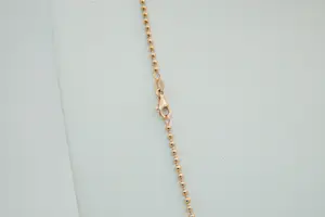 56 - Sierlijk en relatief lang -18 krt - rosé gouden "bolletjes" collier - 60cm kopen? Bied vanaf 540!