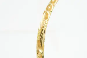 31-  Fraai bewerkte en gefaseerd afgewerkte 20kt geel-gouden armband kopen? Bied vanaf 580!