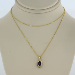 14k geel gouden collier met hanger bezet met saffier 0,70 ct - 45 cm lang kopen? Bied vanaf 150!