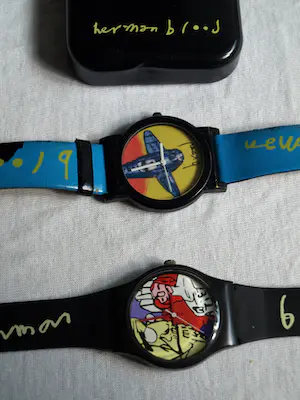 Herman Brood - 2x Horloge , “Erik Satie” en “Vliegtuig” – met doosjes kopen? Bied vanaf 1!