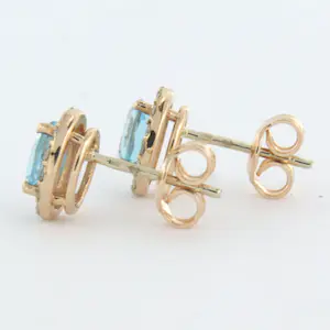 14k rosé gouden entourage oorknoppen met topaas en briljant geslepen diamant kopen? Bied vanaf 375!