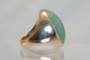 77 - Beneden wettelijk roségoud gehalte ring met ovale groene steen kopen? Bied vanaf 280!