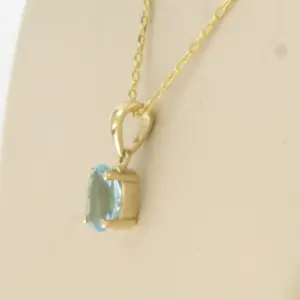 14k geel gouden collier met hanger bezet met blauwe topaas tot. 0,90ct kopen? Bied vanaf 130!