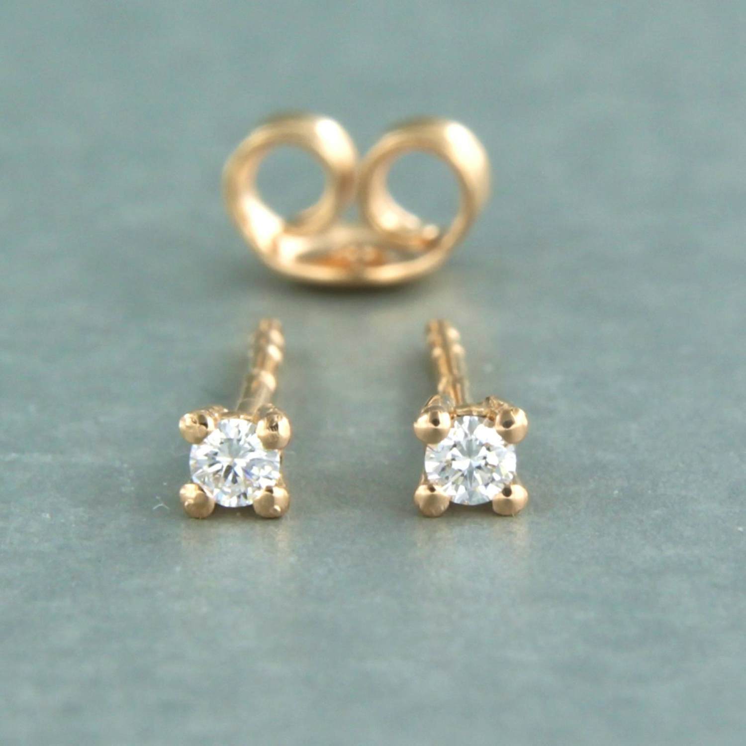 18k roodgouden solitair oorknoppen met briljant geslepen diamant 0.20ct kopen? Bied vanaf 290!