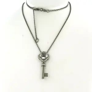 18k goud zwart gerodineerd collier en hanger met bergkristal en diamant kopen? Bied vanaf 710!