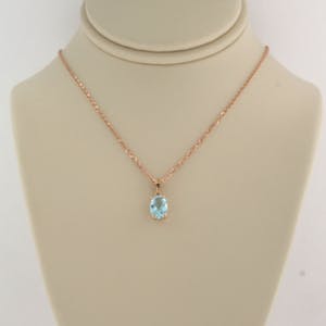 14K Goud - rood gouden collier met hanger bezet met topaas kopen? Bied vanaf 160!