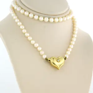 18k gouden hartvormslot bezet met single cut geslepen diamant aan parel collier kopen? Bied vanaf 185!
