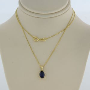 14k geel gouden collier met hanger bezet met saffier 0,70 ct - 45 cm lang kopen? Bied vanaf 150!