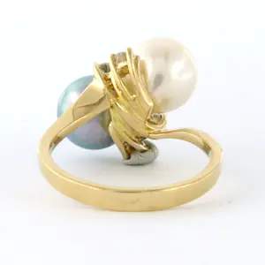 Acheter18k geel gouden ring met een blauwe en witte parel en briljant geslepen diamant? Enchérissez de 550!