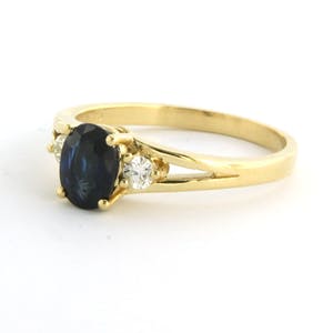 18k geel gouden ring met saffier tot. 0.80ct en briljant geslepen diamant 0.12ct kopen? Bied vanaf 375!