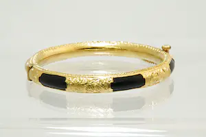 6 - grote Surinaamse 14Krt geel gouden armband met zwarte kunststof kern kopen? Bied vanaf 450!