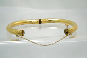 68- Fraai bewerkte Surinaamse 18Krt geel gouden armband met onedele kern kopen? Bied vanaf 370!