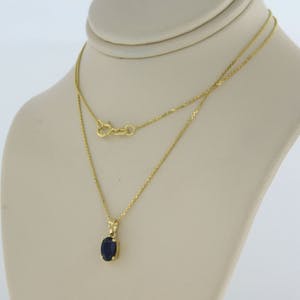 14k geel gouden collier met hanger bezet met saffier 0,70 ct - 45 cm lang kopen? Bied vanaf 150!