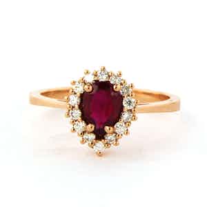 18k rosé gouden entourage ring bezet een robijn en briljant geslepen diamant verkocht voor € 400!