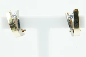 Prachtige set 18 krt bi-color gouden dames oorclips gezet met ca 0.30ct diamant. kopen? Bied vanaf 350!