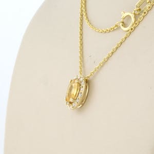 14kgouden collier met hanger bezet met gele saffier en briljant geslepen diamant kopen? Bied vanaf 1!