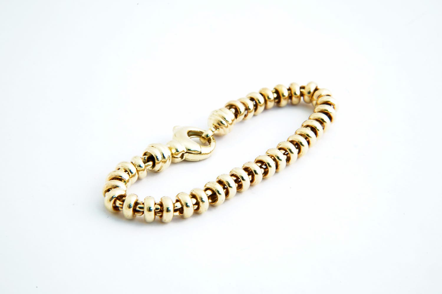 44- Aparte,  14 karaats gouden kinder/dames "ringetjes" model armband kopen? Bied vanaf 430!