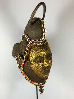 Punu - Tribal used Old African female Bronze mask from the Punu with Cap - Gabon. verkocht voor € 125!