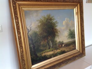 Hendrikus van de Sande Bakhuyzen - A wooded landscape with a horseman conversing with a herdsman and cattle kopen? Bied vanaf 2000!