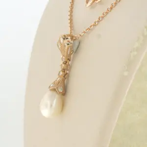 14k gouden collier en hanger met parel en single cut geslepen diamant 0.20ct kopen? Bied vanaf 440!