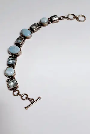 Zilveren Armband bezet met ovale facetgeslepen Aquamarijn en ovale turkoois kopen? Bied vanaf 85!