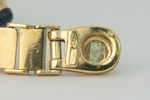 1221- Fraaie 18 karaats gouden "3 om 1" armband - saffier en smaragd - cabuchon kopen? Bied vanaf 920!