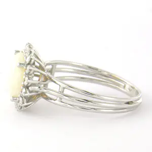 18k gouden ring met centraal opaal en briljant geslepen diamant tot. 0.36ct kopen? Bied vanaf 640!