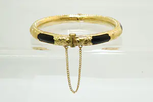 6 - grote Surinaamse 14Krt geel gouden armband met zwarte kunststof kern kopen? Bied vanaf 450!