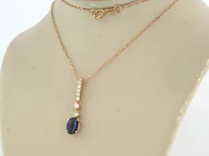 14k gouden collier met hanger bezet met saffier en briljant geslepen diamant kopen? Bied vanaf 350!
