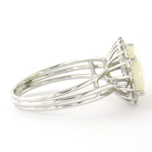 18k gouden ring met centraal opaal en briljant geslepen diamant tot. 0.36ct kopen? Bied vanaf 640!