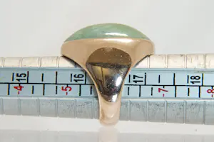 77 - Beneden wettelijk roségoud gehalte ring met ovale groene steen kopen? Bied vanaf 280!