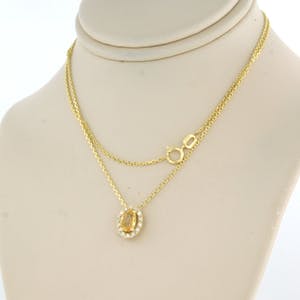 14kgouden collier met hanger bezet met gele saffier en briljant geslepen diamant kopen? Bied vanaf 1!