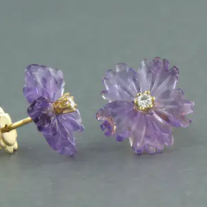 18kgouden oorknoppen in bloem vorm geslepen amethist en briljant geslepen diaman kopen? Bied vanaf 185!