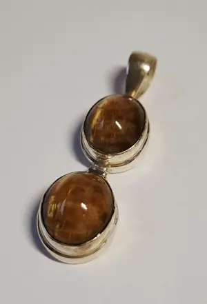 Nieuwe langwerpige zilveren hanger met een mooie  tijgerogen kopen? Bied vanaf 70!