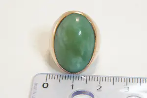 77 - Beneden wettelijk roségoud gehalte ring met ovale groene steen kopen? Bied vanaf 280!