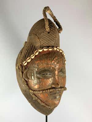 Punu - Tribal used Old African female Bronze mask from the Punu with Cap - Gabon. verkocht voor € 75!