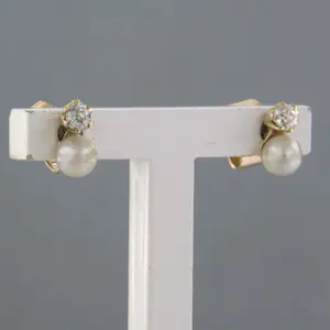 14k rosé gouden oorbellen met parel en diamant 0.10 ct kopen? Bied vanaf 115!