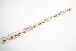 109- Zware 18Krt bicolor gouden & diamanten (0.50ct) fantasie armband kopen? Bied vanaf 1670!