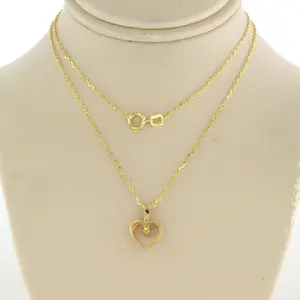 14k gouden collier met hanger bezet met briljant geslepen diamant kopen? Bied vanaf 110!